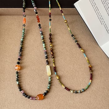 Fém láncon nyaklánc, többszörös rétegű geometrikus medállal, hosszúság 31–40 cm