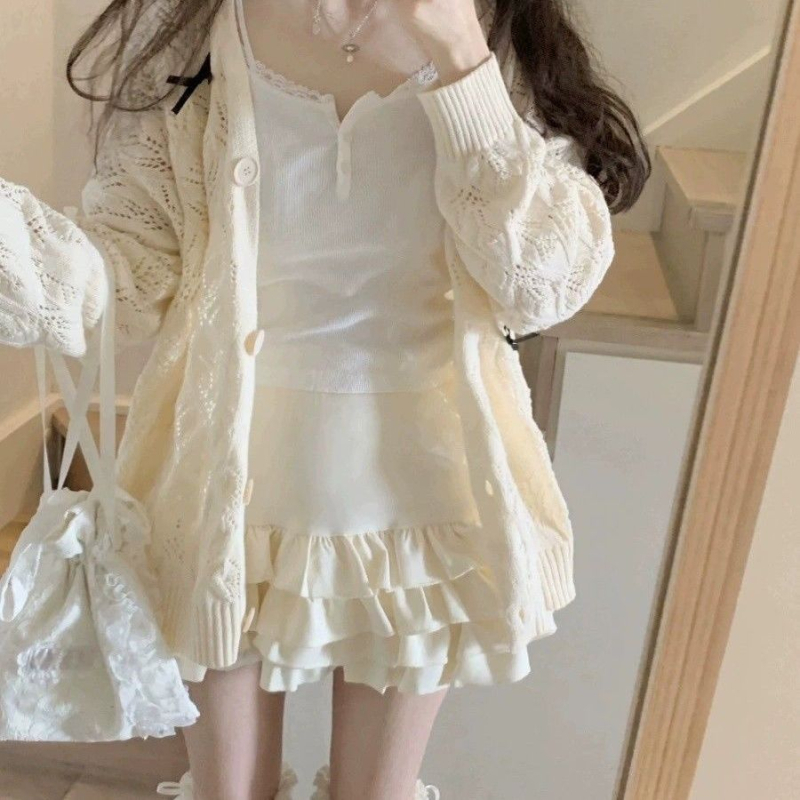 Kötött kardigán lyukacsos mintázattal, pillangó csomóval, V-nyakú, ujj nélküli