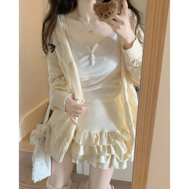 Kötött kardigán lyukacsos mintázattal, pillangó csomóval, V-nyakú, ujj nélküli