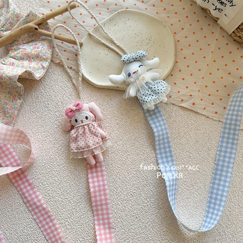 Ručni platneni organizator za ukosnice u obliku lutke, s motivom melodije