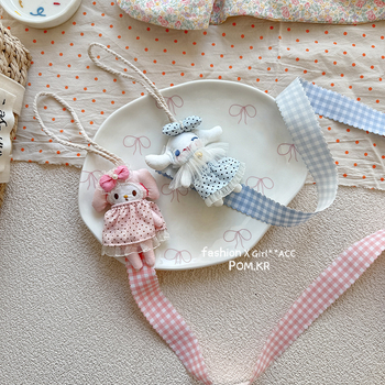 Ručni platneni organizator za ukosnice u obliku lutke, s motivom melodije