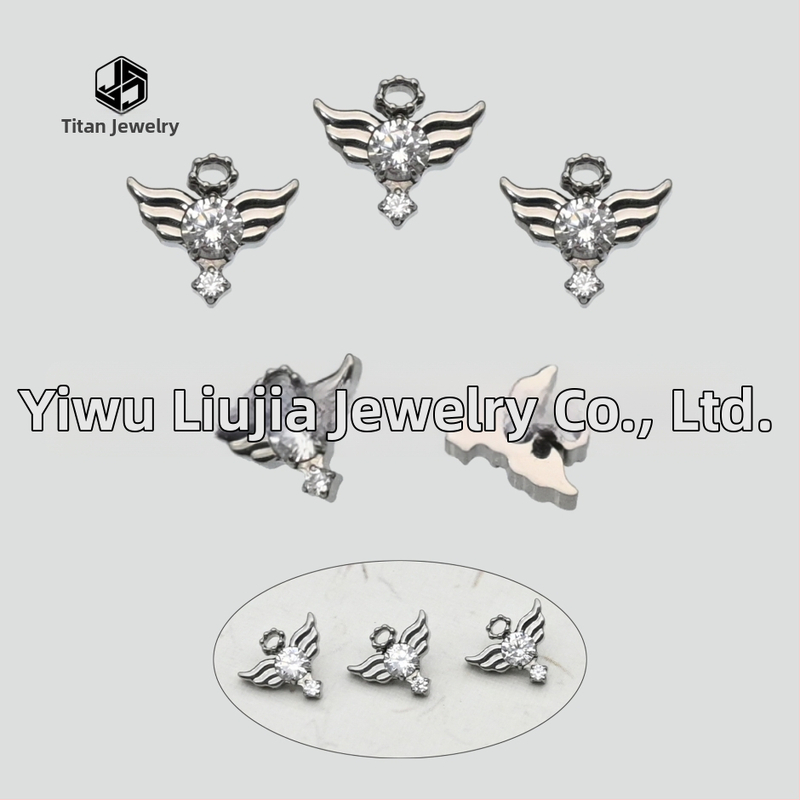 Auskari no implantējama titāna sakausējuma ar eņģeļu spārniem un dimantiem, karikatūras stilā, unisex