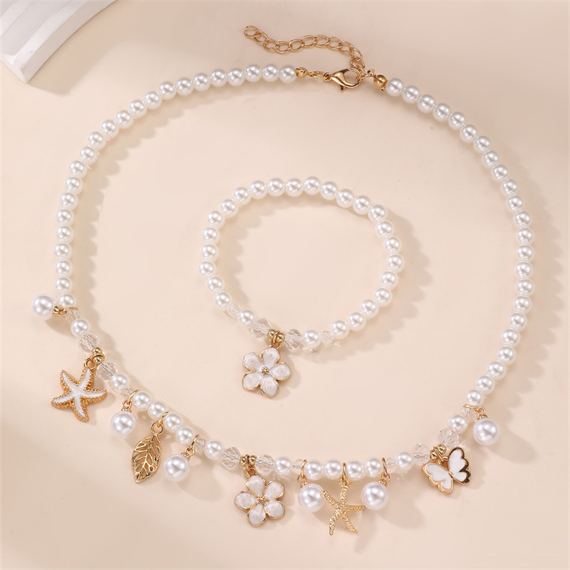 Dječji set: ogrlica i narukvica s privjeskom od smole u obliku mašnice, cvijet i leptir, geometrijski biseri