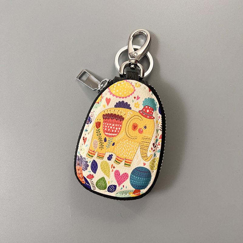 Naistele mõeldud võtmeümbris, ehtne nahk, kahekihiline veiselihast nahk, karikatuurmuster, mugav hoiustamine (Materjal: Ehtne nahk; Tekstuur: Kahekihiline veiselihast nahk; Muster: Karikatuur; Kasutus: Igapäevane)