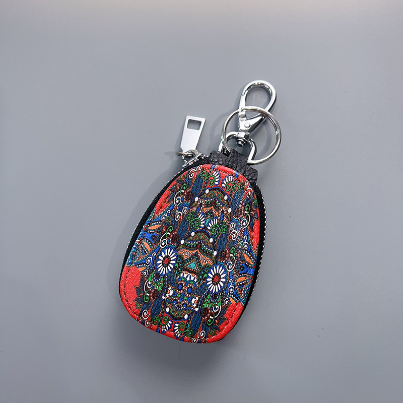 Võtmete ümbris ehtne nahk, kahekordne veisnahk, karikatuurimustriga, ladustamiseks.