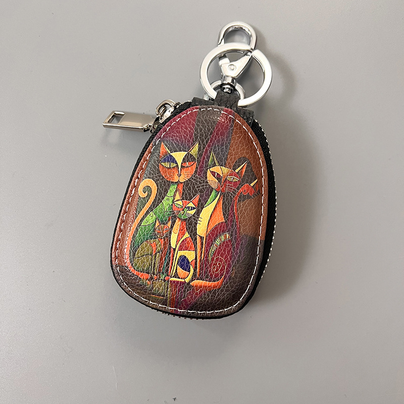 Võtmete ümbris ehtne nahk, kahekordne veisnahk, karikatuurimustriga, ladustamiseks.