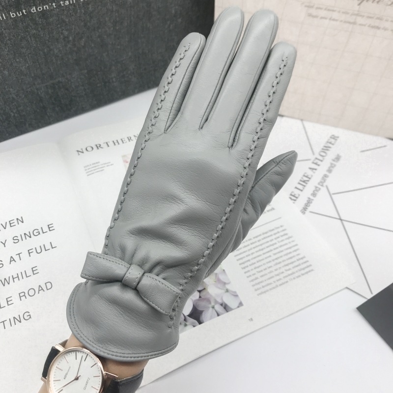 Női báránybőr kesztyűk – koreai stílusú masnival, jacquard hátsó rész, érintőképernyő-kompatibilis meleg, szélálló, vezetéshez és kültéri tevékenységekhez ősszel és télen.