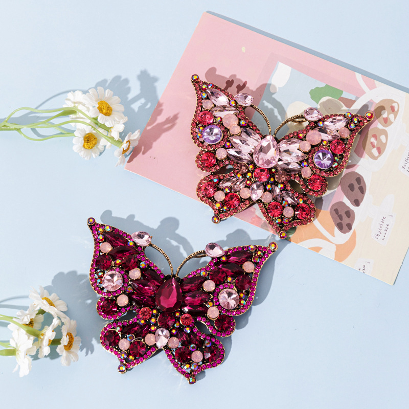 Ötvözetes pillangó bross, csepp olajos felülettel, könnyű luxus stílus, uniszex kiegészítő