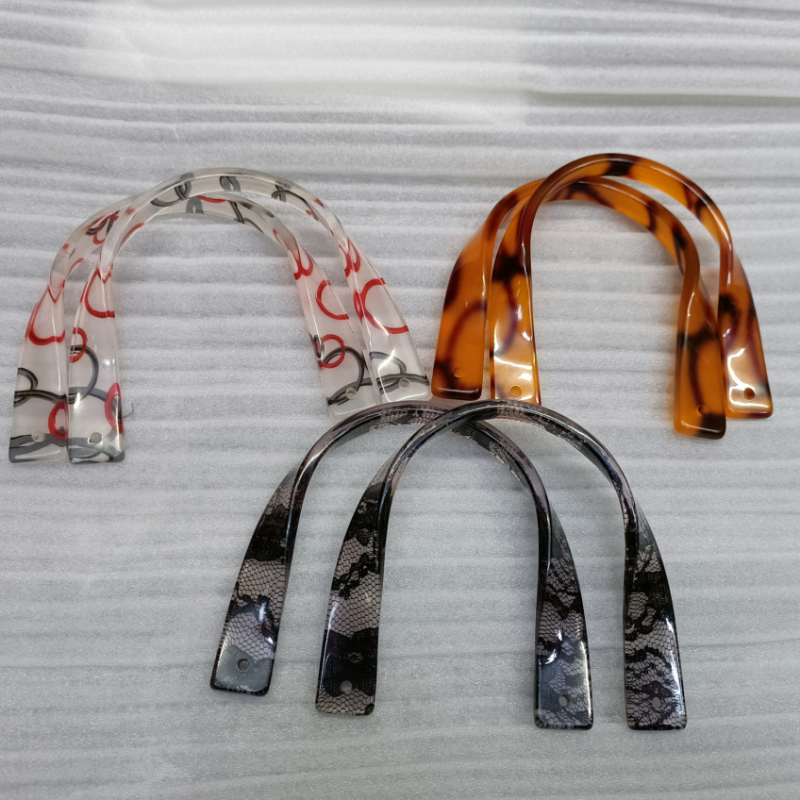 Akril táska fogó U-alakú, csavart kialítással (Márka: Hiro Mori; Anyag: akril; Szezon: 2024 nyár; Funkció: tehercsökkentés; Licencelt magáncímke: Igen)