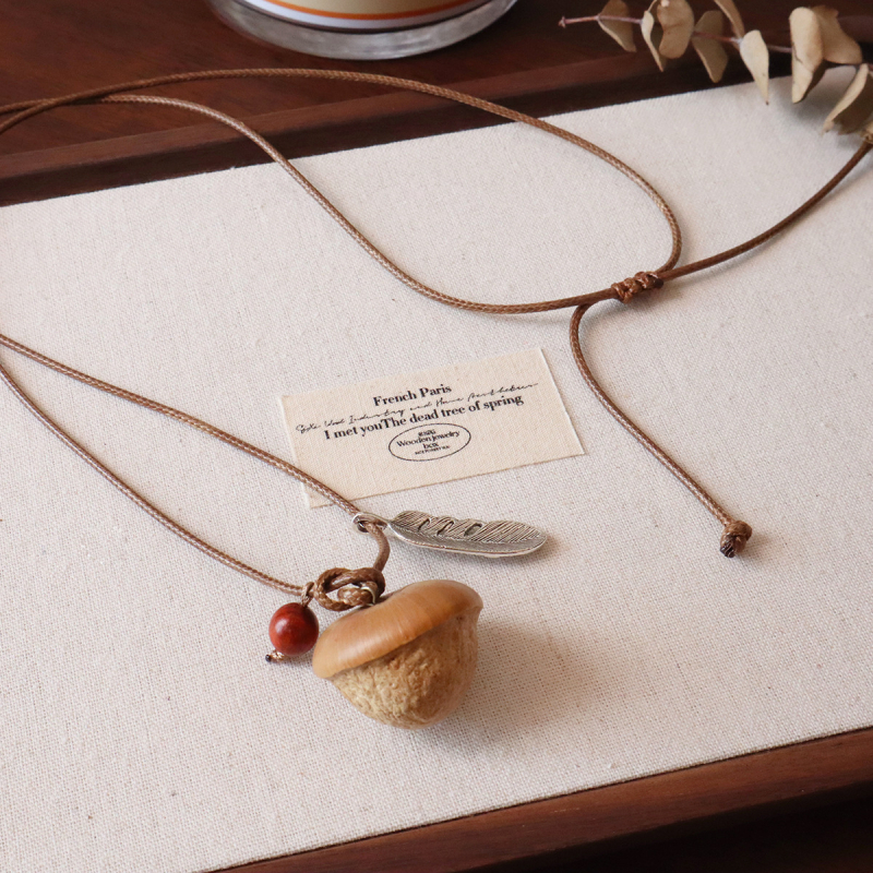 Nutshell zieda formas kulons uz džemperiņa ķēdei – regulējams garums, sievietēm, etnisks stils