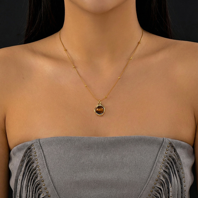 Tigriszem gyöngyös nyaklánc, kézzel készített, kígyócsont lánccal, többszintű dizájn, rozsdamentes acél medállal