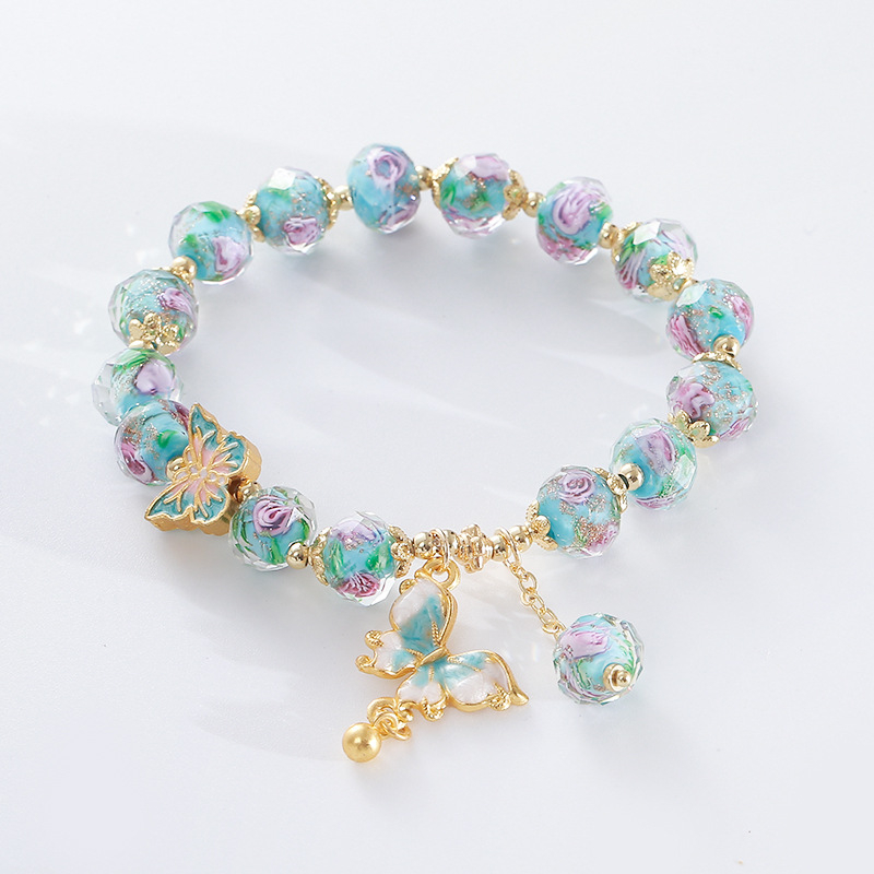 Női kézműves karkötő üveg- és lazurit gyöngyökkel, pillangó medállal, hercegnő-stílusú ékszer