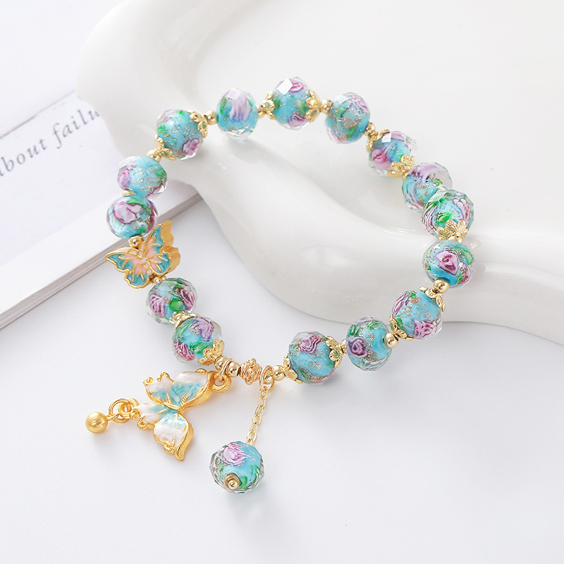 Női kézműves karkötő üveg- és lazurit gyöngyökkel, pillangó medállal, hercegnő-stílusú ékszer