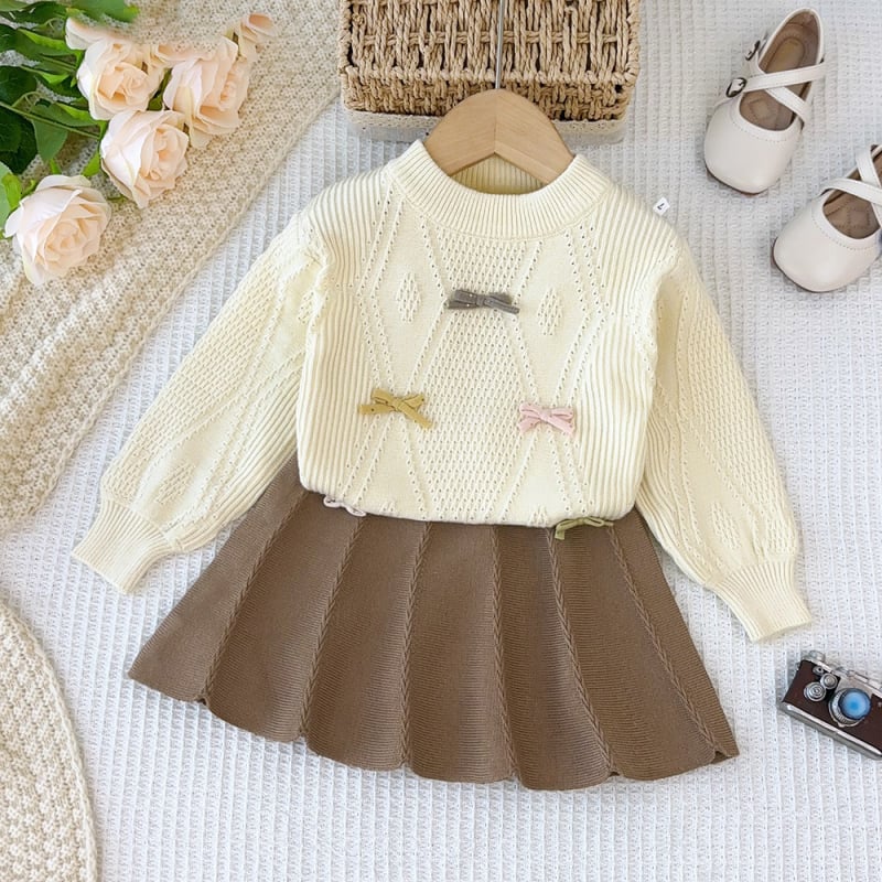 Set pentru copii din două piese: pulover tricotat în stil coreean cu funda și fustă asortată; mâneci lungi, guler rotund; culoare solidă; material acrilic; pentru copii între 3 și 8 ani; toamnă/iarnă.