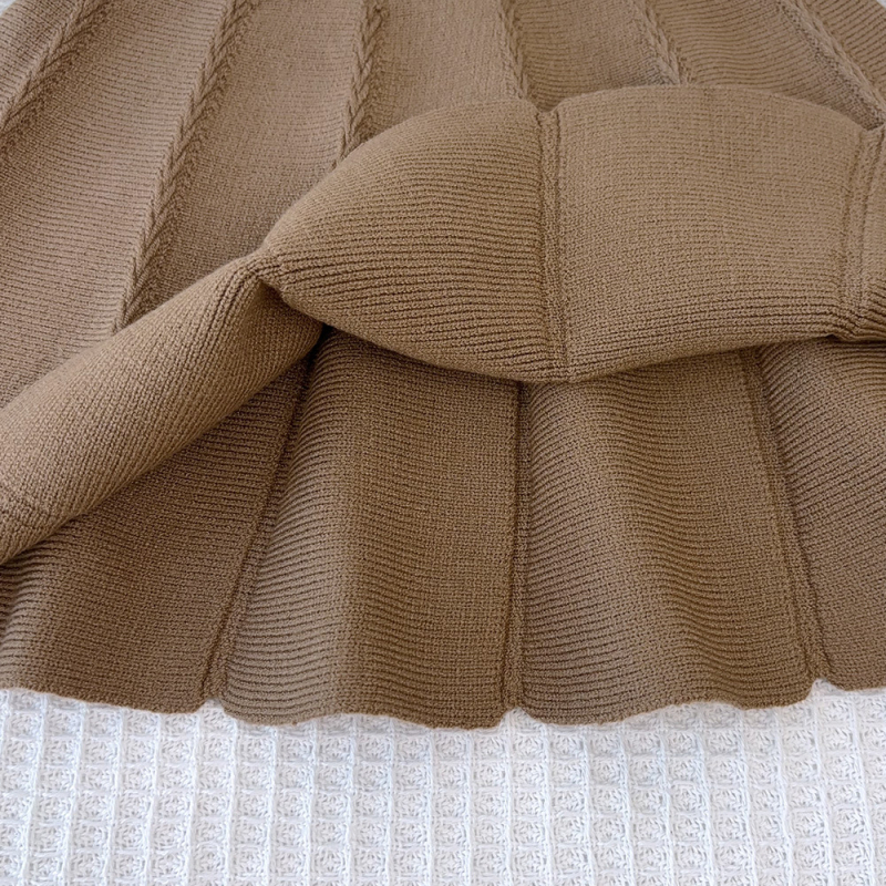 Set pentru copii din două piese: pulover tricotat în stil coreean cu funda și fustă asortată; mâneci lungi, guler rotund; culoare solidă; material acrilic; pentru copii între 3 și 8 ani; toamnă/iarnă.