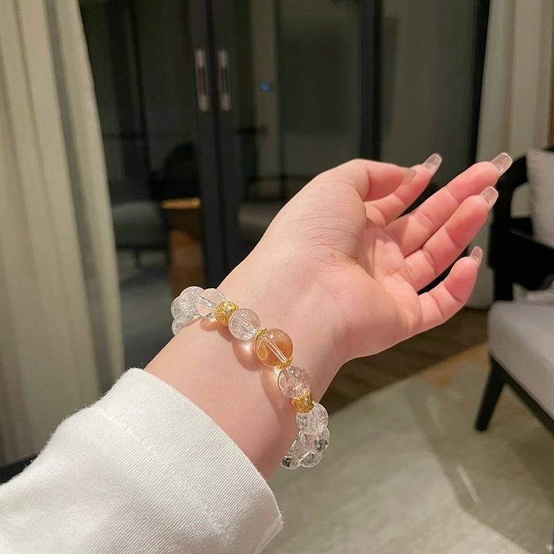 Fehér kristály karkötő, citrin oldalkövek, ezüst- és aranyozott bevonat, könnyed luxus stílus