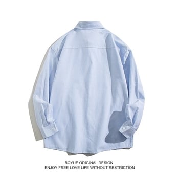 Prúžkovaná košeľa s dlhými rukávmi, voľný strih, golier s klopou, detaily na vreckách, tkanina z polyesterovej zmesi (81–90% polyester), bez žehlenia