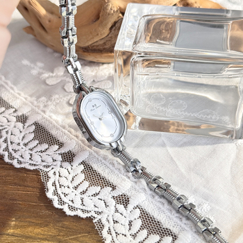 Ženski kvarcni sat s ovalnim brojčanikom, jednostavan retro stil (Pogon: kvarc; Brojčanik: ovalni; Kućište: smjesa materijala; Remen: legura; Kopča: nehrđajući čelik)