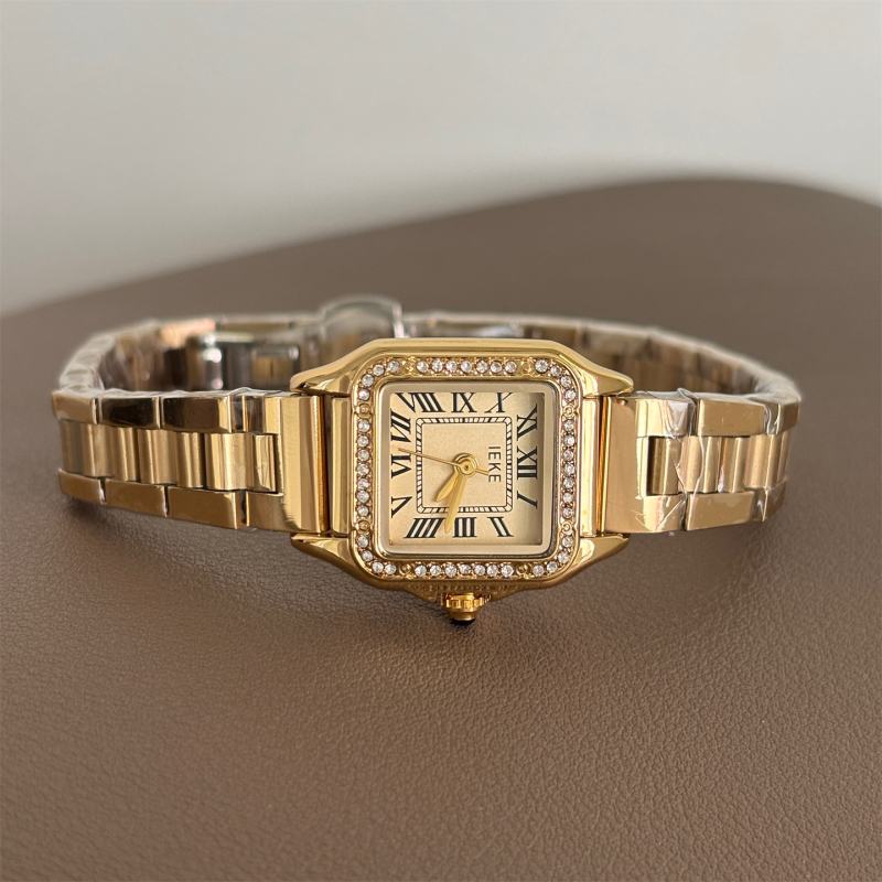 Ieke női kvarcóra, négyszögletes számlap, fém tokozás, rozsdamentes acél szíj, spirál koronával