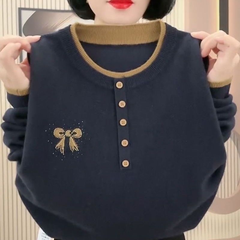 Pulover tricotat brodat, guler rotund, croială lejeră, mâneci trei sferturi, cusături încrucișate în culori - stil chinezesc.