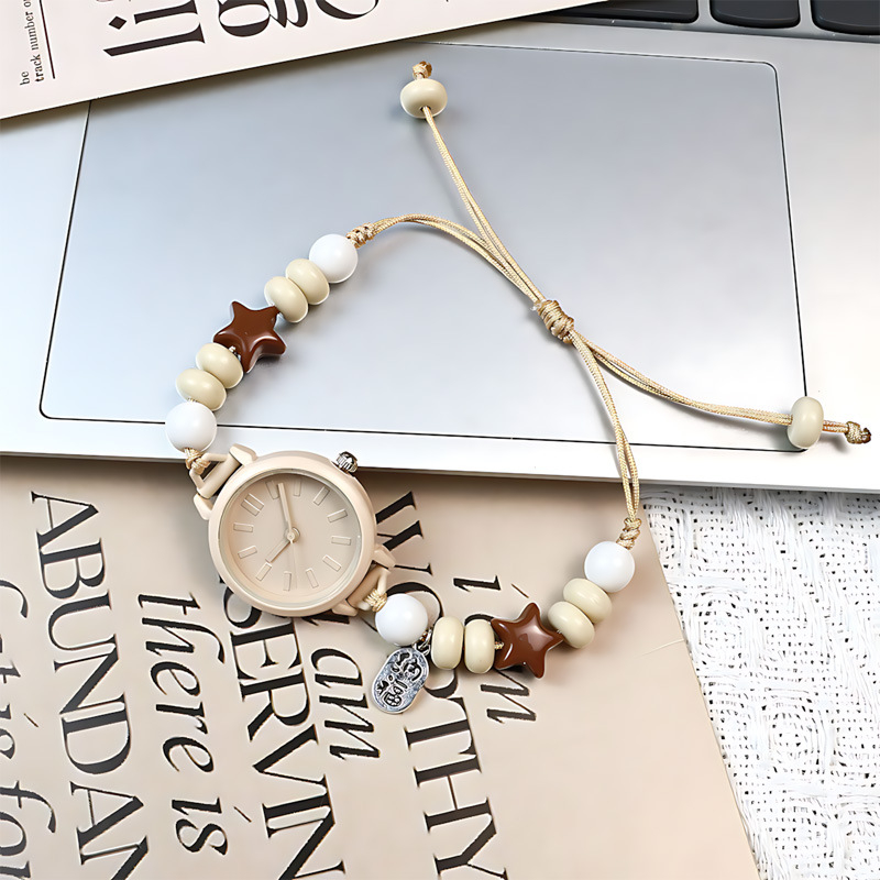 Női analóg kvarc karóra, kerek tárcsás, mutató kijelzés, szövött szíj, műanyag tok, nem vízálló