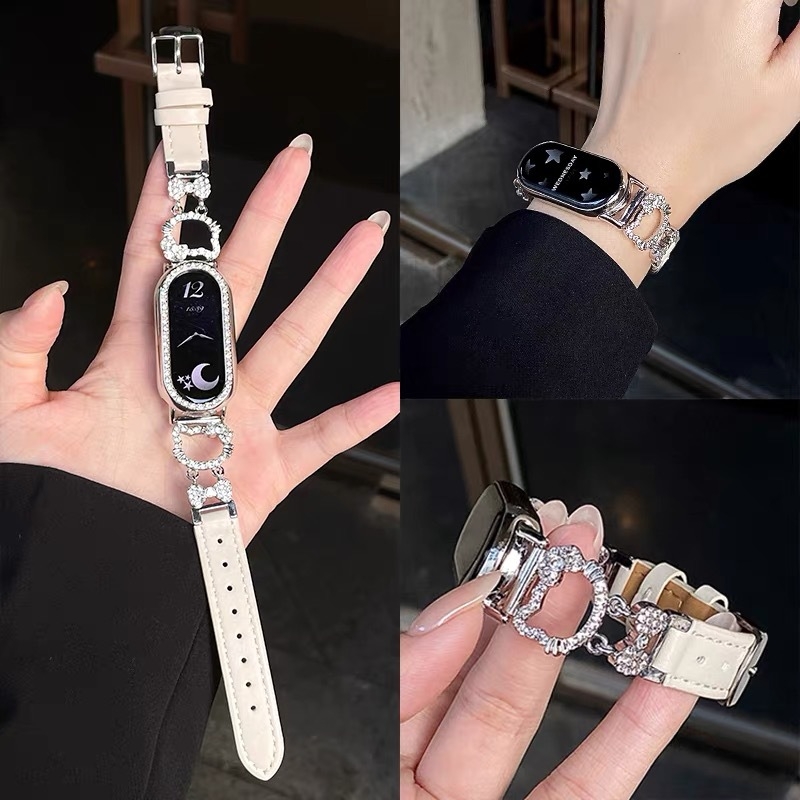 Remienok Xiaomi Mi Band Hello Kitty Edition, zliatina + koža s lesklým efektom, kompatibilný s Mi Band 8/9/10, pracka s kolíkom, hmotnosť 22 g