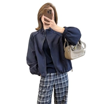 Casual kratka jakna s stojećim ovratnikom i raglan rukavima — poliester 70–80%, jednobojna, duljina 40–50 cm, zatvarač, slobodan kroj