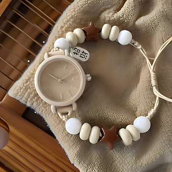 Női analóg kvarc karóra, kerek számlappal, szövött szíjjal és műanyag tokkal