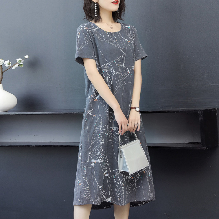 Milk Silk midi haljina, opušteni struk, kratki rukavi, okrugli izrez, otisak, ljetni gradski ležerni stil.