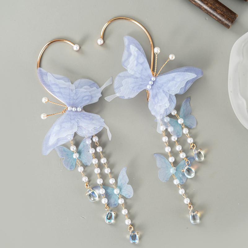 Gyermekeknek készült kínai stílusú pillangóval és bojtokkal díszített fülbevaló, kézzel készült, eredeti dizájn; anyagok: üveg / lazurit; szezon: 2025 tél