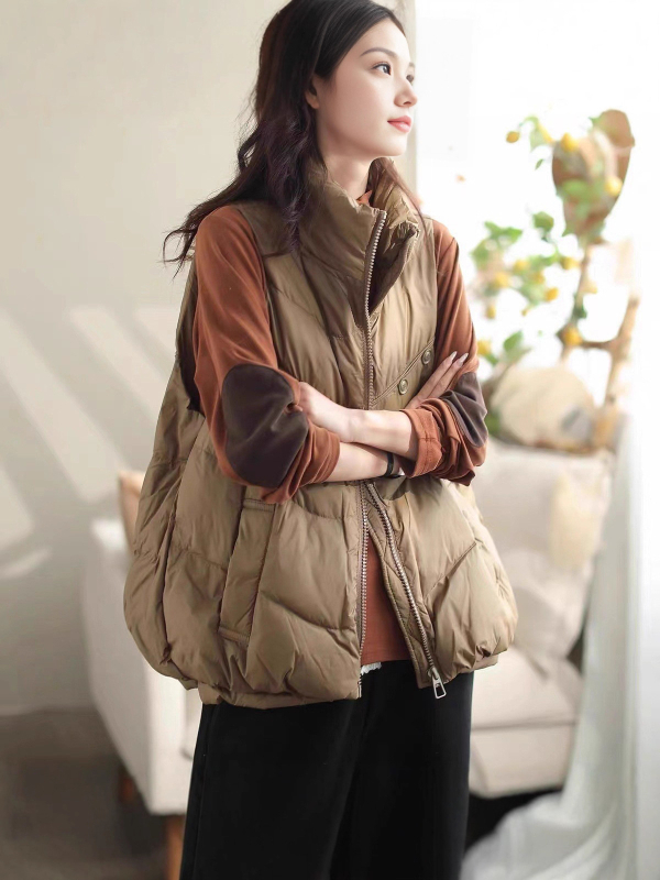 Ženska vesta s perjem, vanjski materijal poliester, zatvarač, stojeći ovratnik