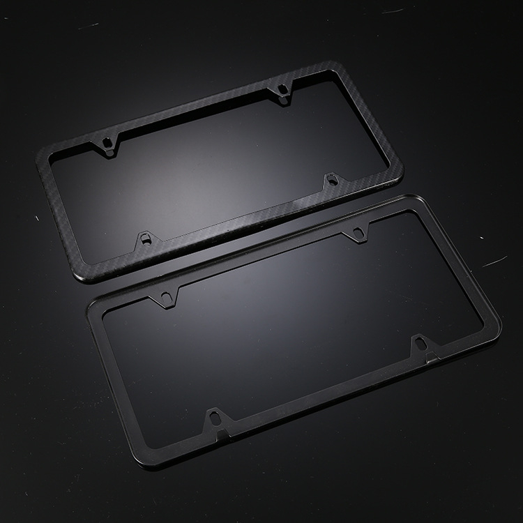 Okvir za registarsku pločicu od nehrđajućeg čelika s karbonskim izgledom, četiri otvora, za mala vozila. Model 02.