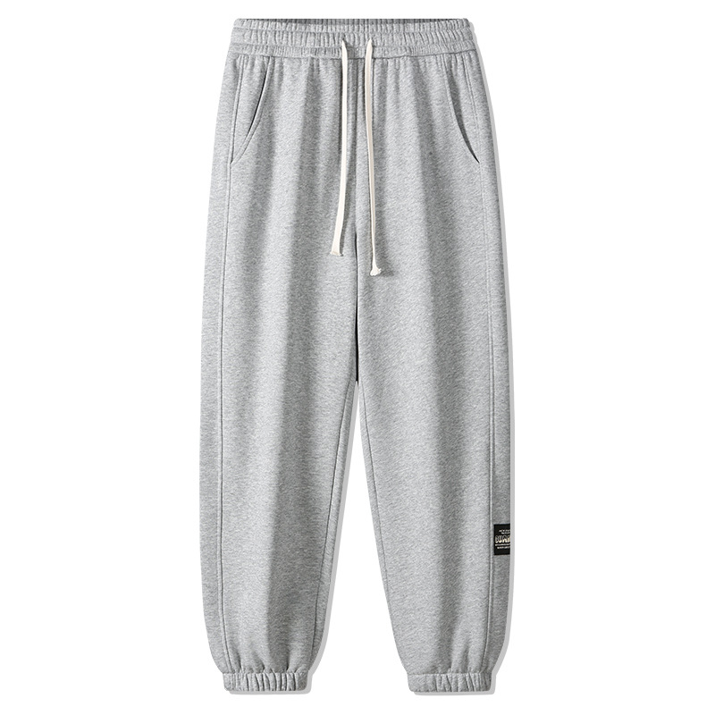 Muške pamučne hlače s fleec podstavom, srednji porast, blago šireći kroj, duljina 9/10, zatvaranje šnuralom, debela tkanina, svakodnevne sportske hlače urbanog stila