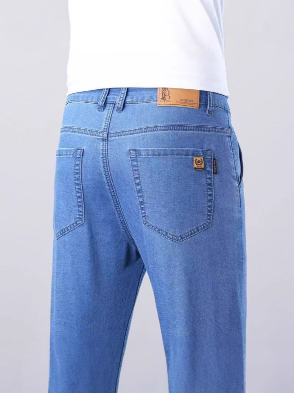 Férfi egyenes szabású farmer, elasztikus, középmagas derék, gombos zárás, 80% pamut, tavasz–ősz