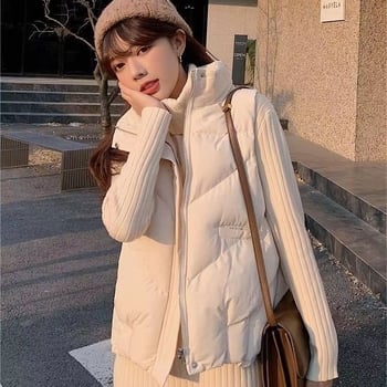 Pufasta vesta sa stojećim ovratnikom, opuštena duga silueta, proljeće 2025