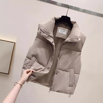 Ženska vesta sa stojećim ovratnikom i zatvaračem, punjenje od pernatog materijala, vanjski materijal poliester, uži kroj, normalna duljina, elegantan gradski stil