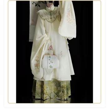 Hanfu set: izvezeni top s stojećim ovratnikom i oblačnim ramenima, suknja tipa horse-face; glavni materijal poliester 70–80%, sekundarni ispod 30%, jesensko-zimski Ming stil