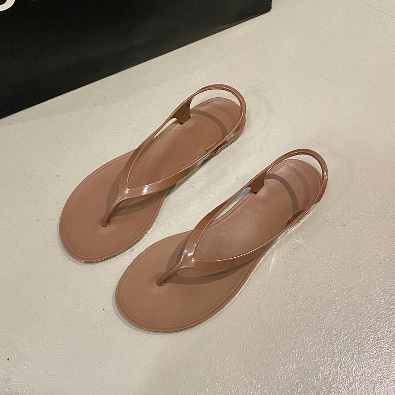 Ženske PVC japanke s ravnom potplatom, slip-on za svakodnevnu unutarnju i plažnu upotrebu; gornji dio, unutarnji dio i taban PVC, jednobojni dizajn.