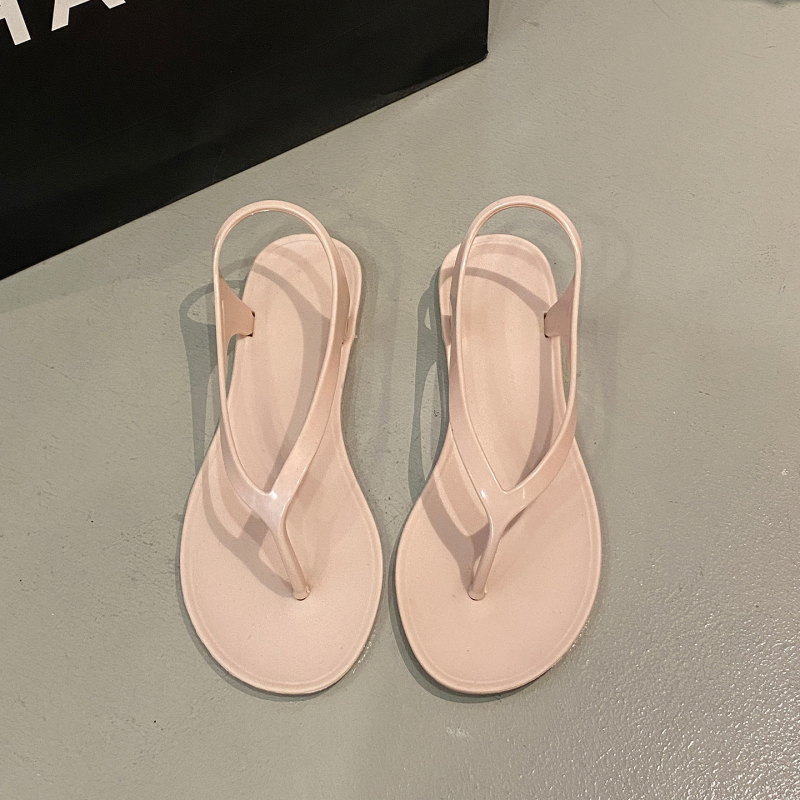 Ženske PVC japanke s ravnom potplatom, slip-on za svakodnevnu unutarnju i plažnu upotrebu; gornji dio, unutarnji dio i taban PVC, jednobojni dizajn.