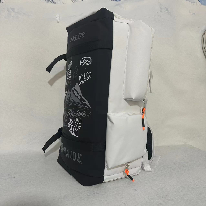 Nagy kapacitású síhátizsák, külön cipőrekesszel, száraz–nedves elválasztás, graffiti mintázat, snowboard/sí felszerelés táska