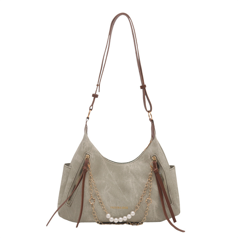 PU bőrből készült női táska, keresztpántos vállon át, függőleges téglalap alakú forma, cipzáras nyitás, belső telefontartó zseb