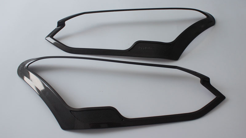 Isuzu MU-X 2017–2020 első fényszóró keret, ABS műanyag, öntapadós hátoldal, előfényekhez kompatibilis, testreszabható