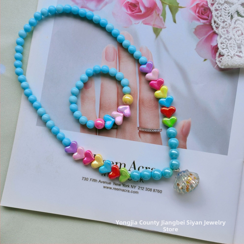 Laste südamekujuline kaelakee ja käevõru komplekt, käsitöö plastikust/ vaigust, merineitsi koorikdisain, kaheosaline komplekt, printsesside sari