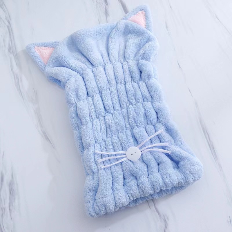 Macskaszőr fülű hajszárító sapka, korallflís mikroszálas, gyors száradású, puha kapucni; rostok poliészter és nylon; tömeg 50–79 g; 32 szál