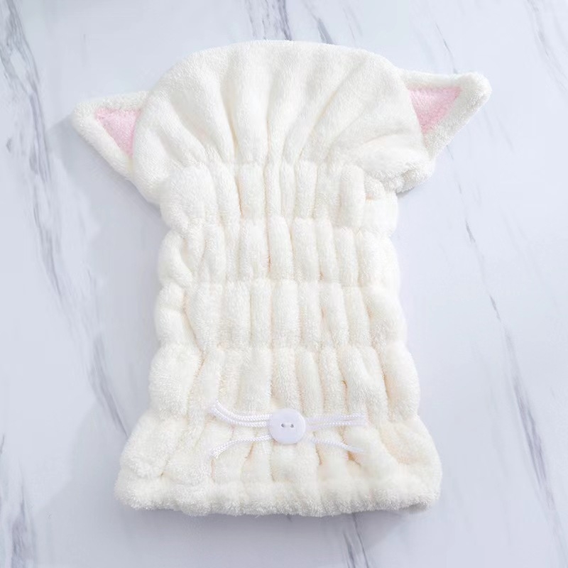 Macskaszőr fülű hajszárító sapka, korallflís mikroszálas, gyors száradású, puha kapucni; rostok poliészter és nylon; tömeg 50–79 g; 32 szál