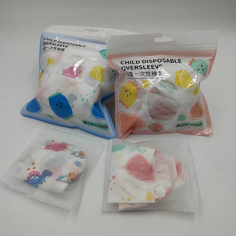 Vienkartinės vaikų rankovių dangteliai – atsparūs vandeniui, dėmėms atsparūs, kvėpuojanti membrana, neausta medžiaga, 10 porų pakuotėje