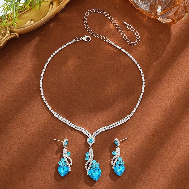 Ékszerszett: fülbevaló és nyaklánc rhinestone-okkal, elektroplatinált felület, minta szív/könnycsepp/harang