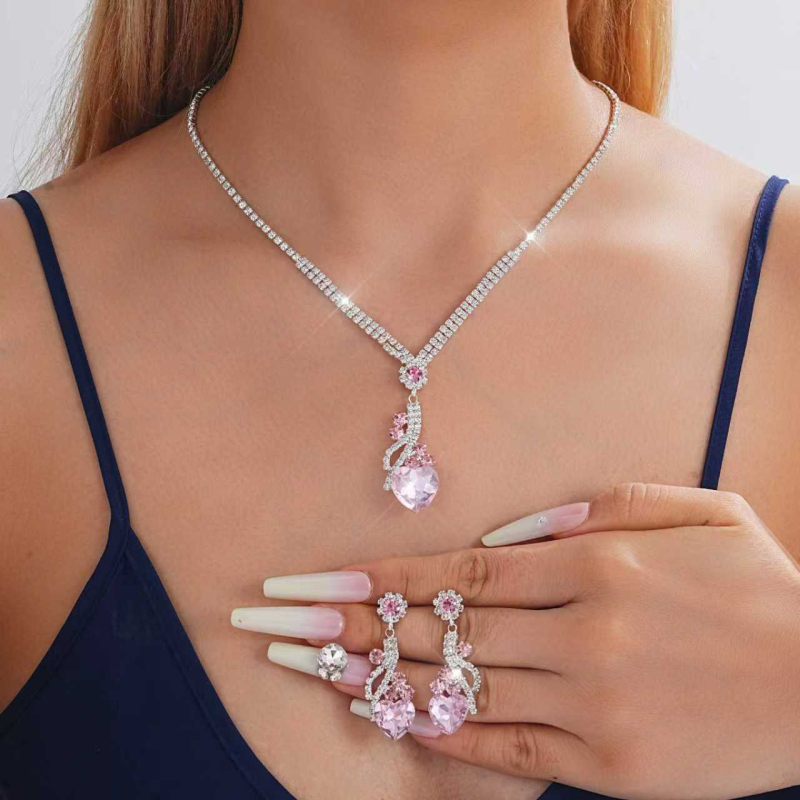 Ékszerszett: fülbevaló és nyaklánc rhinestone-okkal, elektroplatinált felület, minta szív/könnycsepp/harang