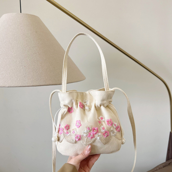 Youxuan уличен стил платнена bucket bag с капак; затваряне с връзка; подплата полиестер; презрамка единична