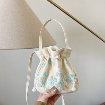 Youxuan уличен стил платнена bucket bag с капак; затваряне с връзка; подплата полиестер; презрамка единична